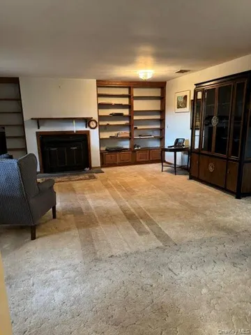 a view of livingroom with furniture and staircase