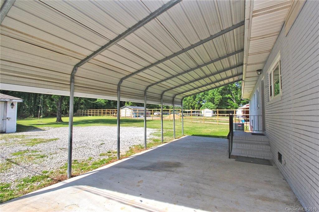 6201 Tuckaseegee Road Charlotte, NC 28208 - Photo 5 of 21 a view of a backyard with swimming pool