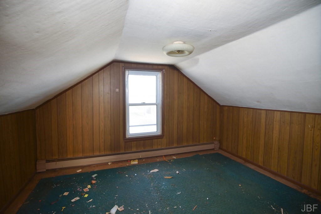 495 Chicago Street Fall River, MA 02721 - Photo 14 of 26 an empty room with wooden floor and windows