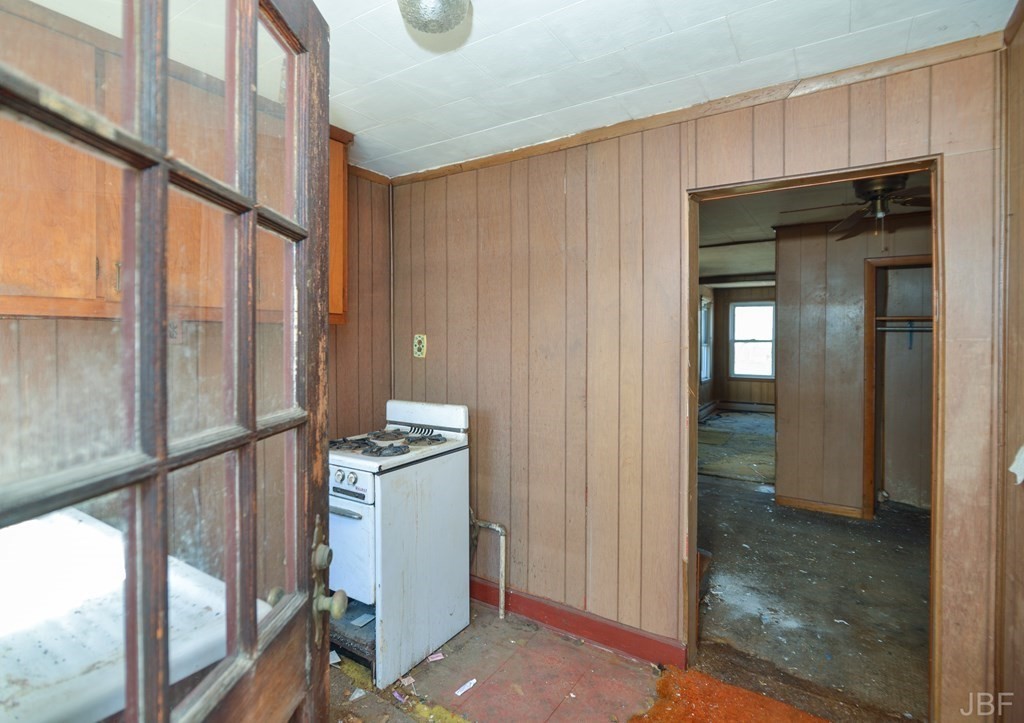 495 Chicago Street Fall River, MA 02721 - Photo 16 of 26 a kitchen with stainless steel appliances granite countertop a refrigerator and a stove