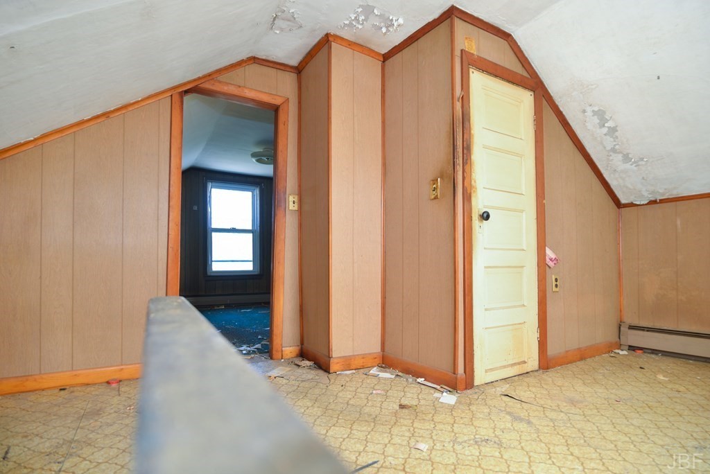 495 Chicago Street Fall River, MA 02721 - Photo 19 of 26 a view of a hallway with wooden floor and staircase
