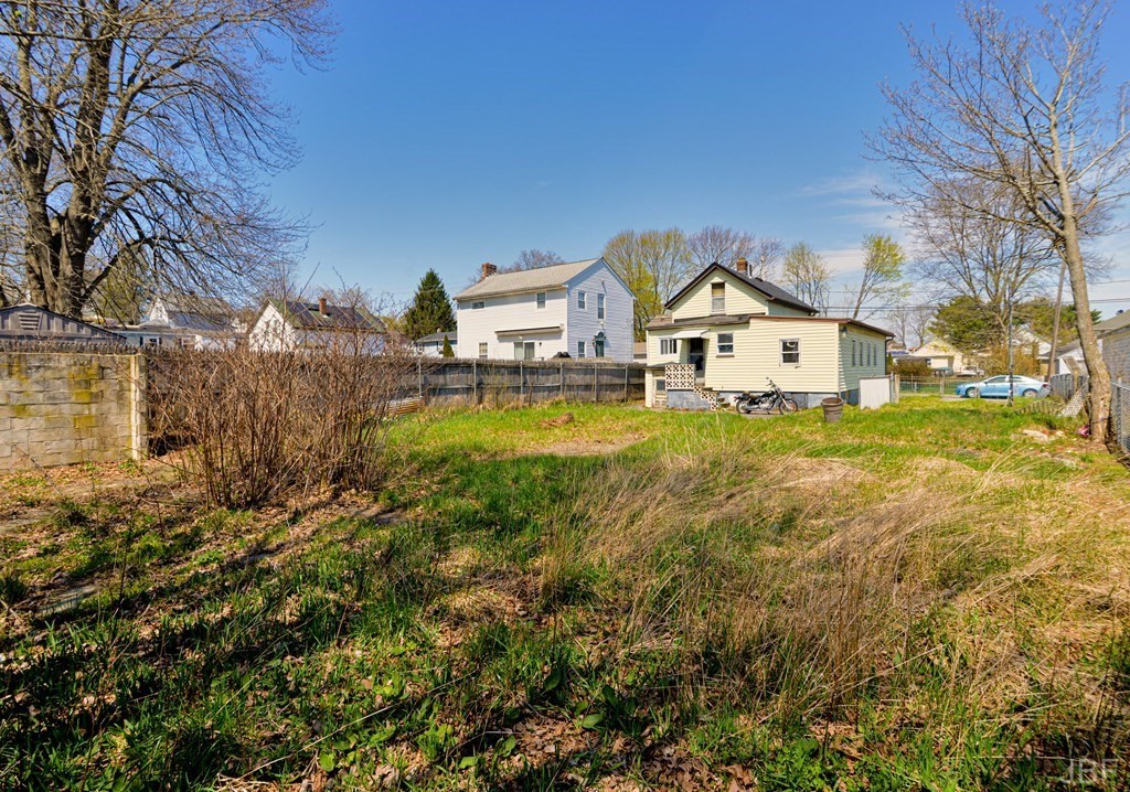 495 Chicago Street Fall River, MA 02721 - Photo 26 of 26 a view of a house with a big yard and large trees