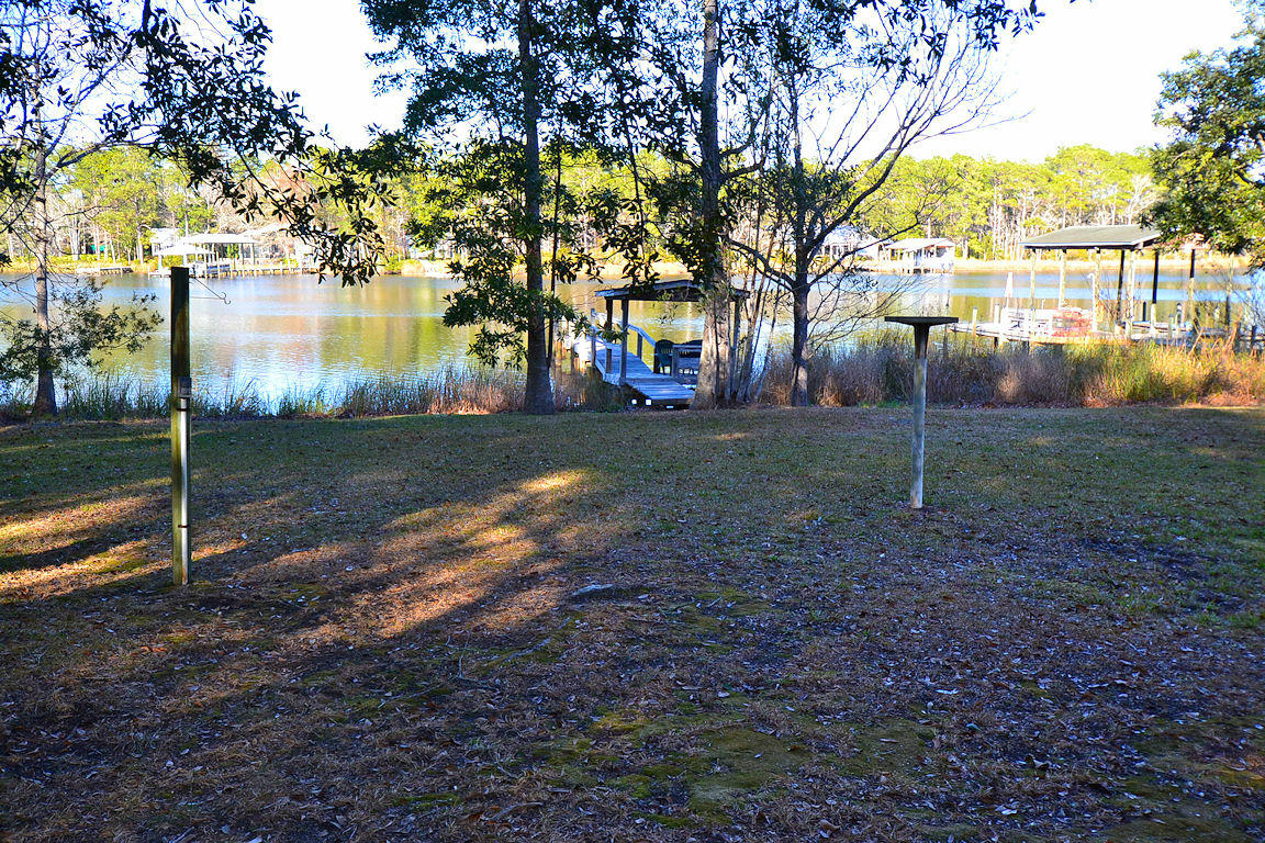 924 Bay Grove Road Freeport, FL 32439 - Photo 5 of 5 a backyard of a house with lots of green space