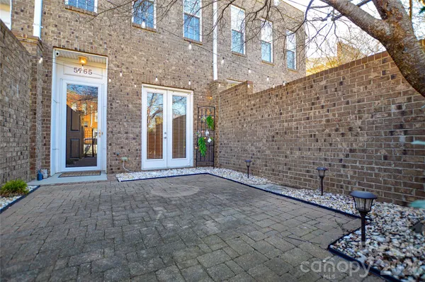 a view of a brick house with a street