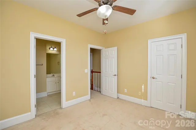 a view of an empty room with a bathroom