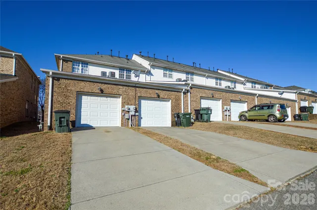a front view of a building with parking