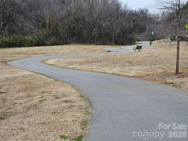 a view of a yard with snow on the road