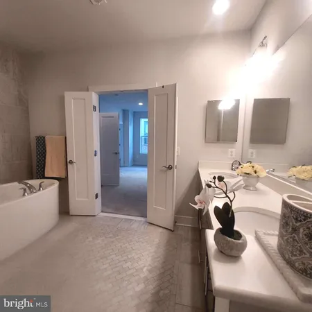 a bathroom with a toilet a sink and glass door