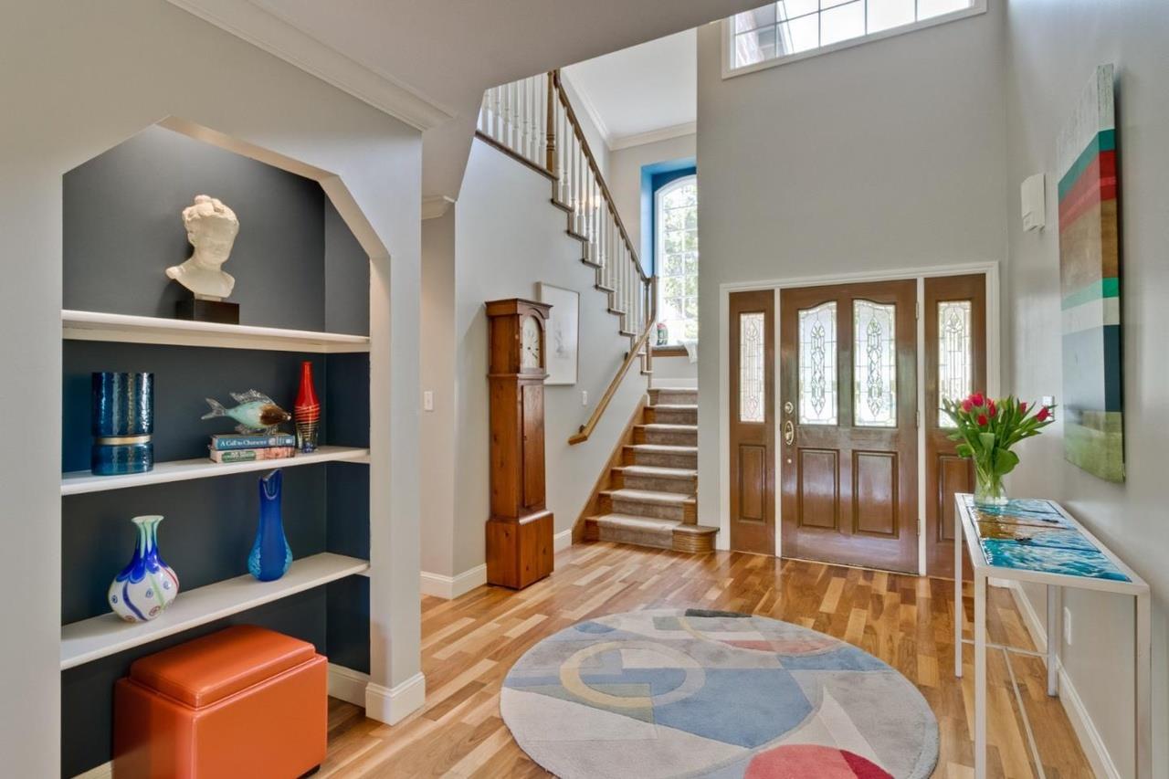 1909 Ray Drive Burlingame, CA 94010 - Photo 2 of 10 a living room with lots of furniture and a wooden floor