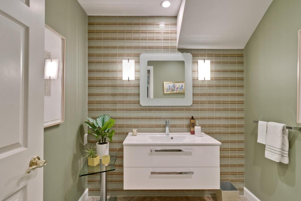 1909 Ray Drive Burlingame, CA 94010 - Photo 6 of 10 a bathroom with a sink a mirror and a shower