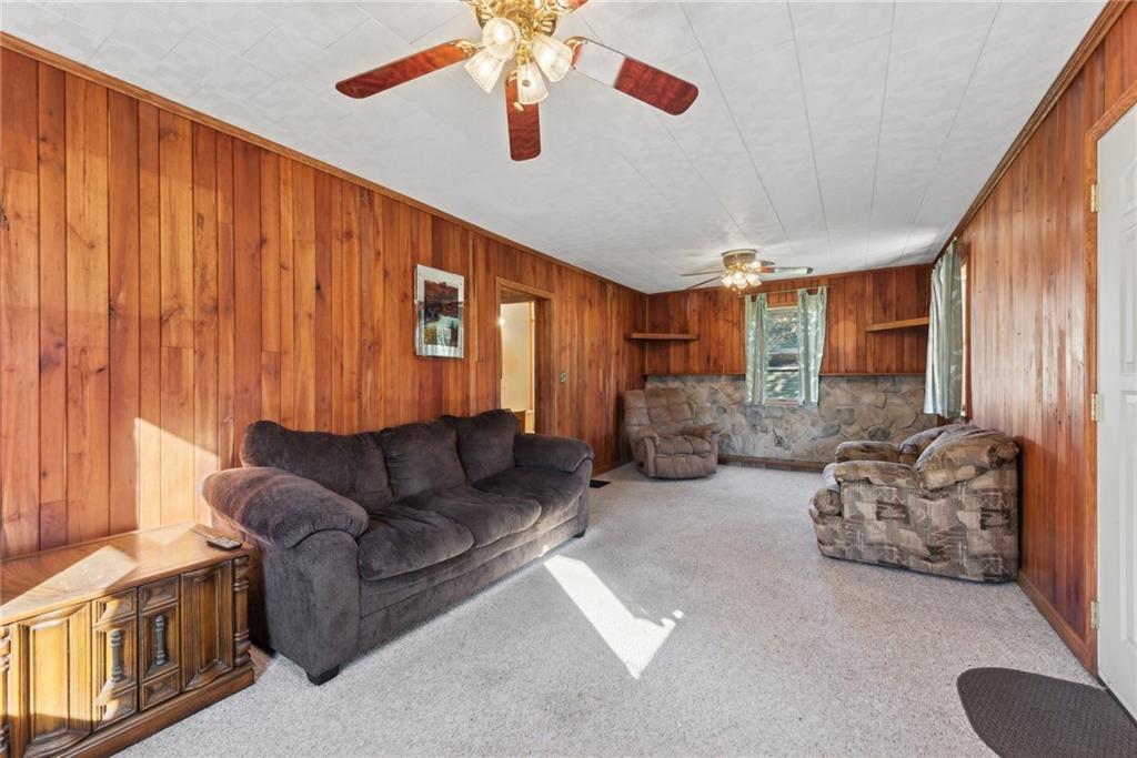 124 Hampton Road Mill Run, PA 15464 - Photo 5 of 32 a living room with furniture and a large window