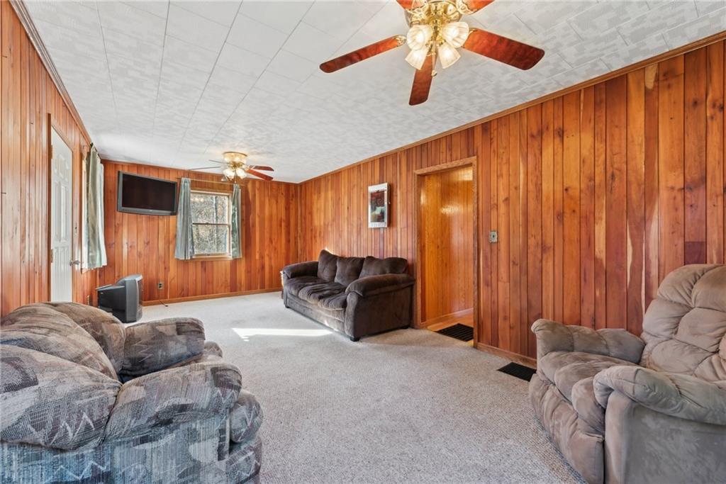 124 Hampton Road Mill Run, PA 15464 - Photo 6 of 32 a living room with furniture and a large window