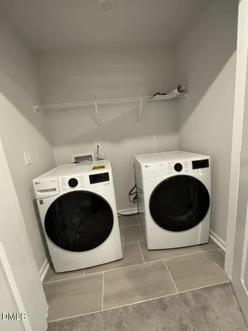 a white toilet and tub next to a bathroom sink