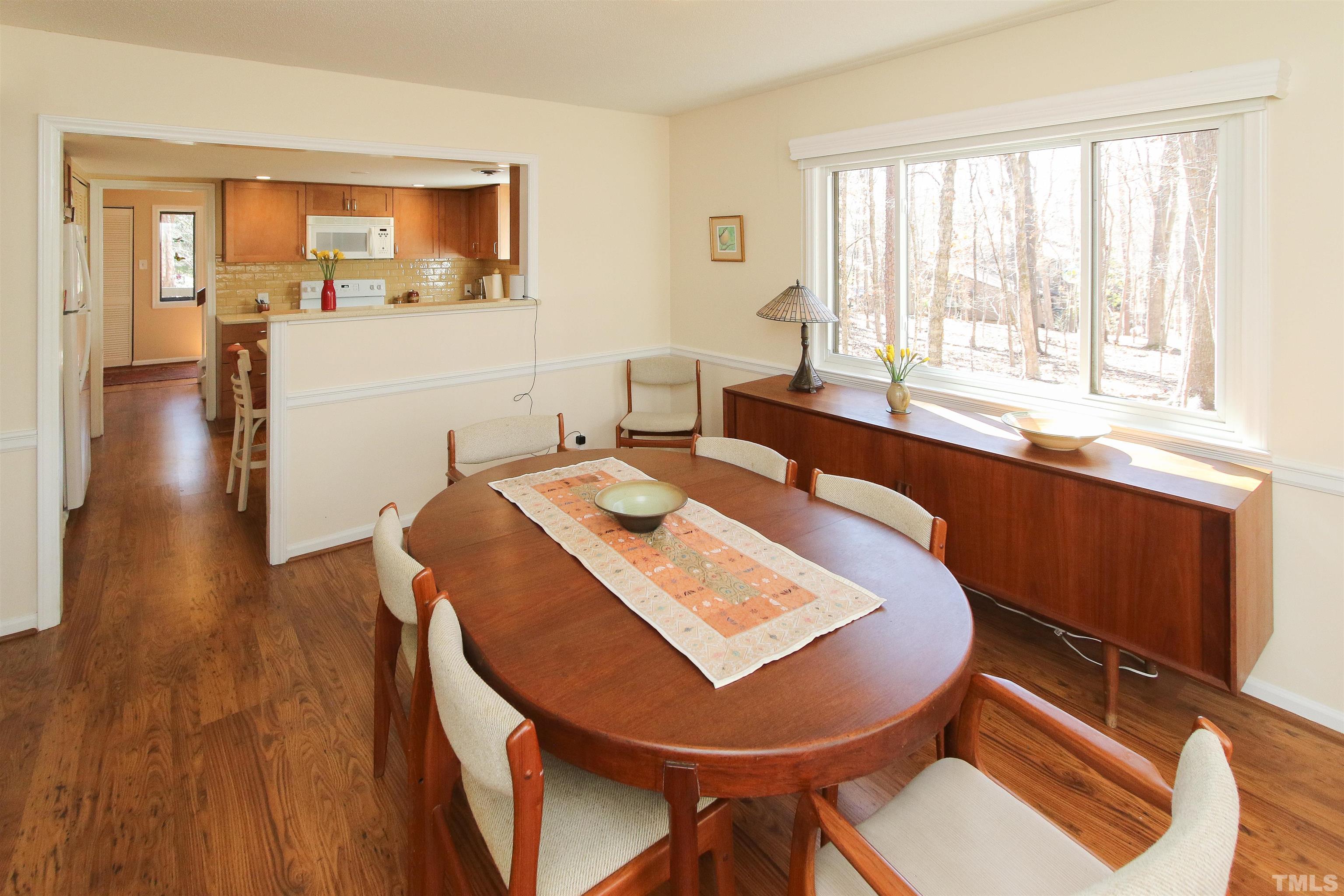 3084 Colony Road, Unit 3084A Durham, NC 27705 - Photo 9 of 16 a view of a dining room with furniture and wooden floor