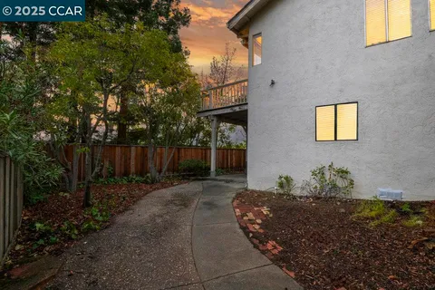 a front view of a house with wooden fence