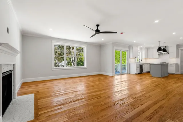 a view of a kitchen with a stove wooden floor and a kitchen