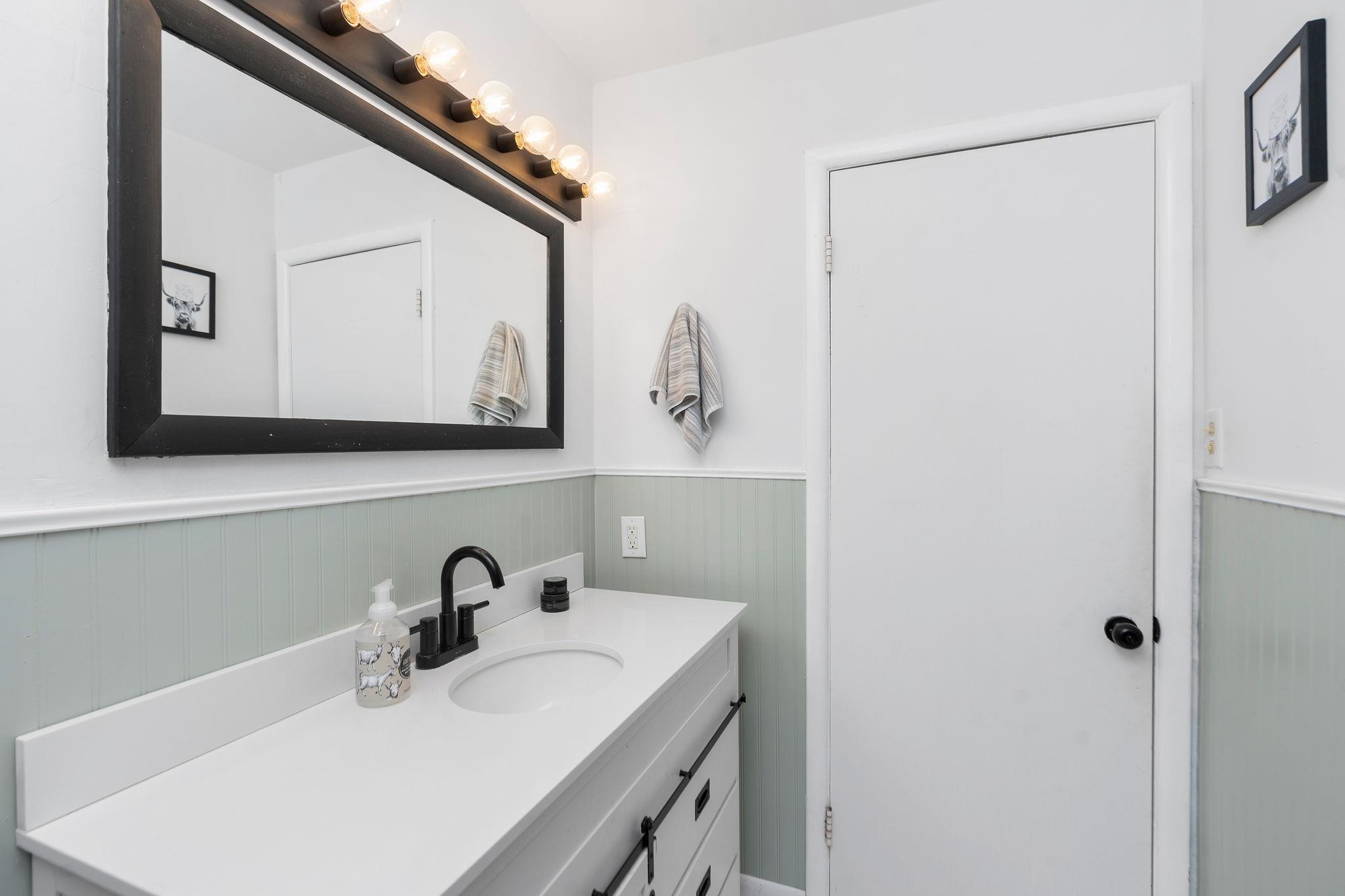 1064 Ladd Road Waynesboro, VA 22980 - Photo 14 of 51 a bathroom with a sink and a mirror