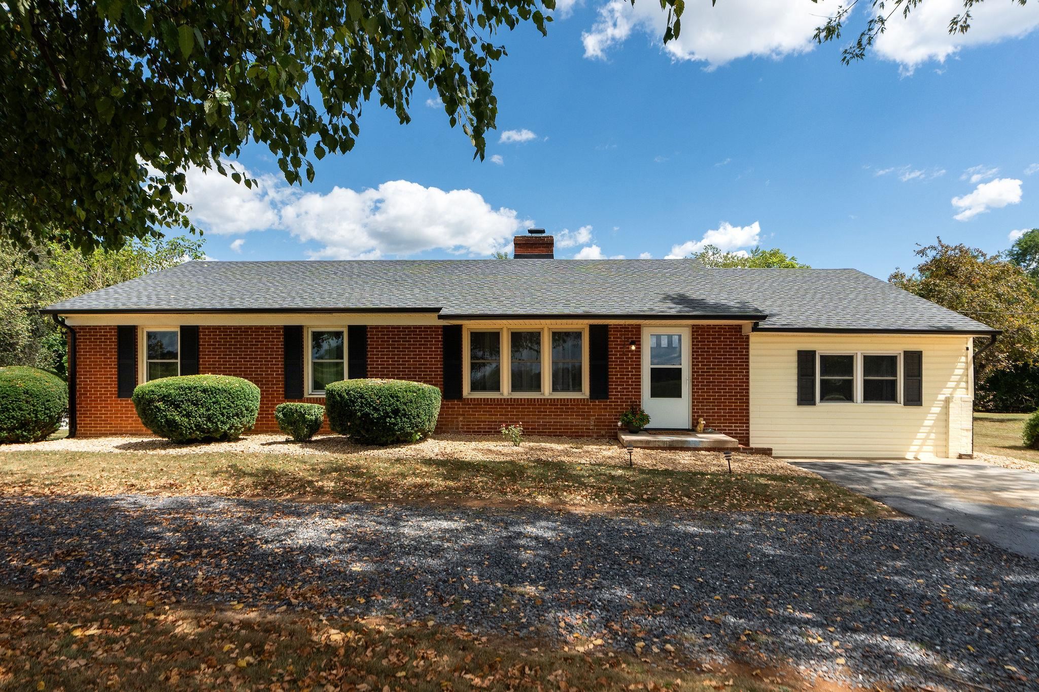 1064 Ladd Road Waynesboro, VA 22980 - Photo 2 of 51 a front view of house with yard and trees in the background