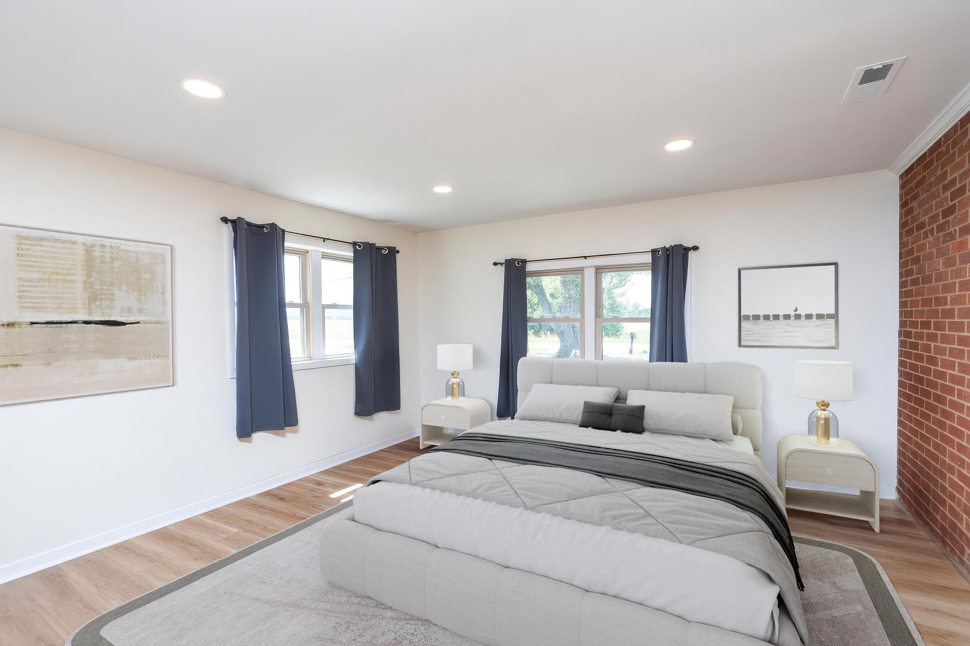 1064 Ladd Road Waynesboro, VA 22980 - Photo 24 of 51 a bedroom with a large bed and wooden floor