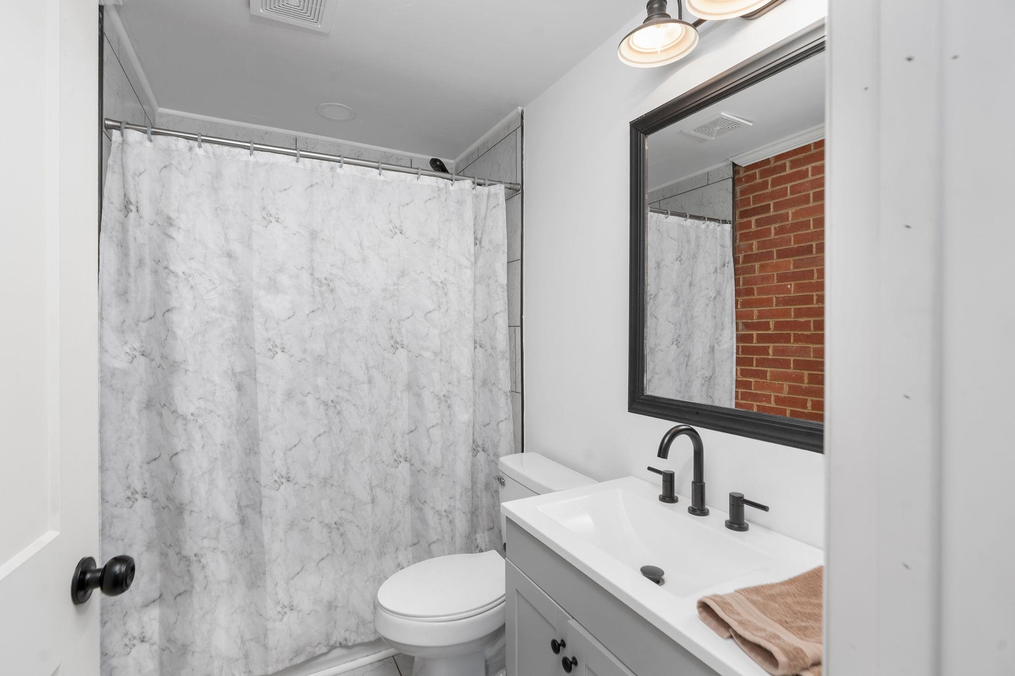 1064 Ladd Road Waynesboro, VA 22980 - Photo 26 of 51 a bathroom with a sink and a mirror