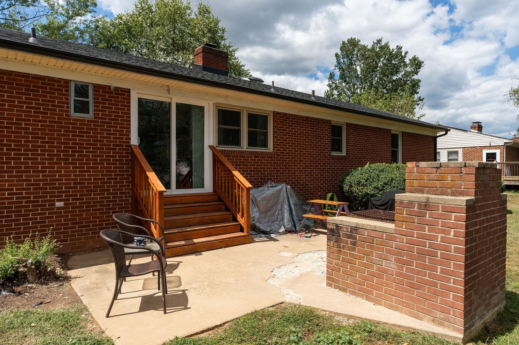 1064 Ladd Road Waynesboro, VA 22980 - Photo 34 of 51 a view of a patio with a table and chairs and potted plants