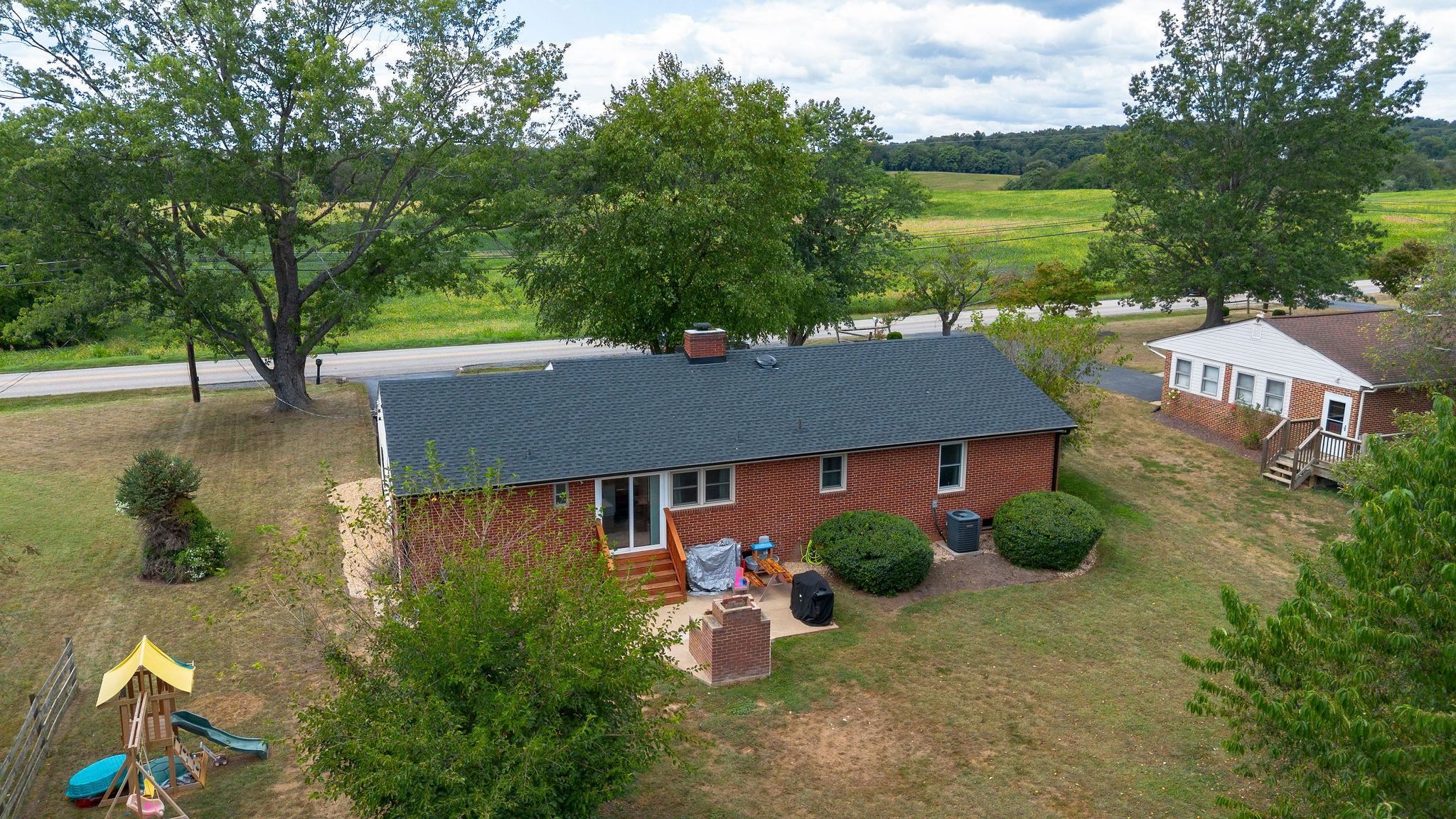 1064 Ladd Road Waynesboro, VA 22980 - Photo 35 of 51 a backyard of a house with outdoor seating