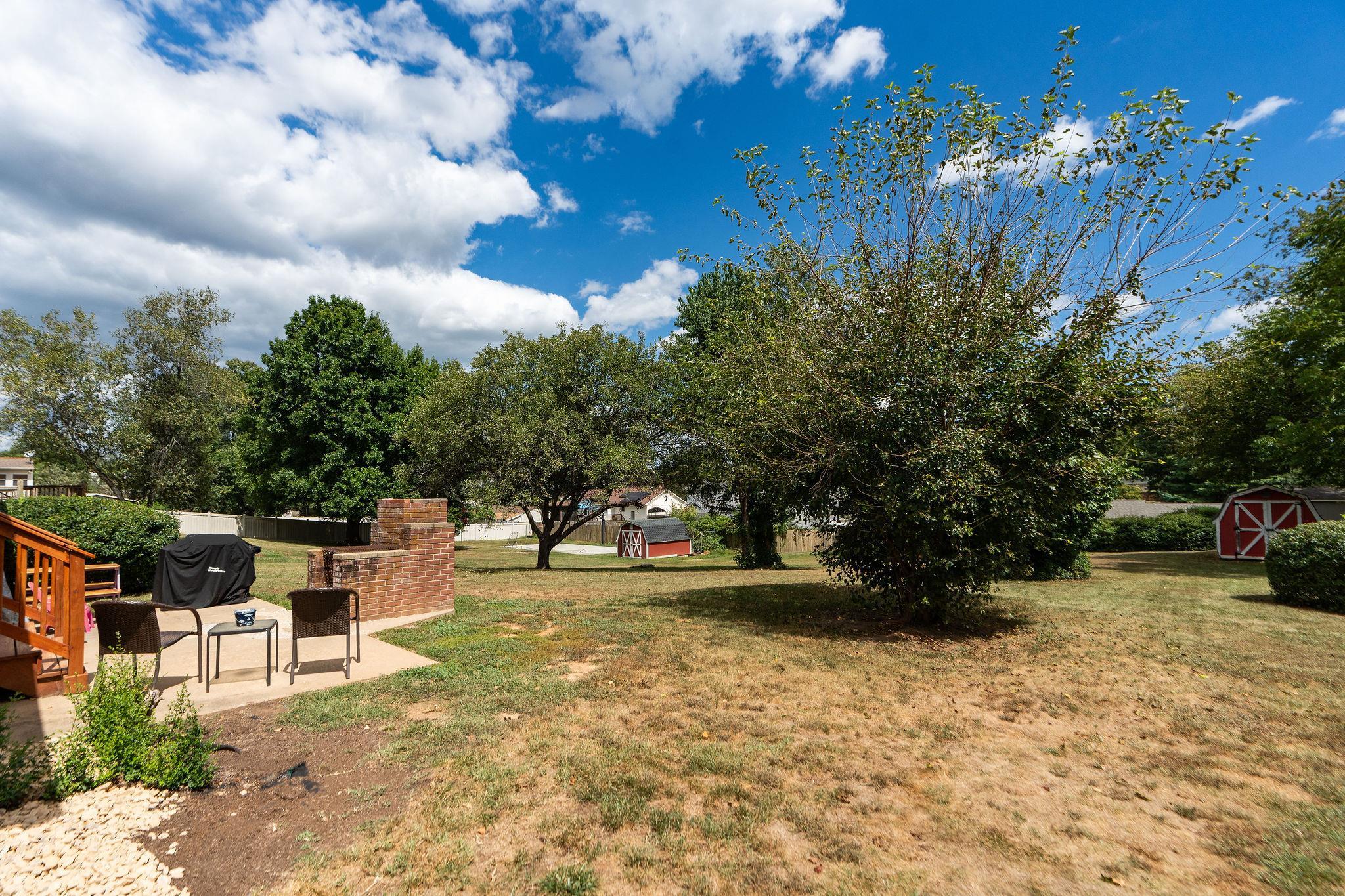 1064 Ladd Road Waynesboro, VA 22980 - Photo 37 of 51 a view of a yard with plants and a bench