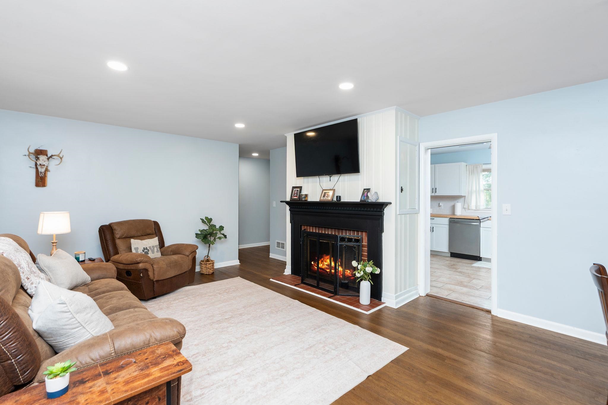 1064 Ladd Road Waynesboro, VA 22980 - Photo 5 of 51 a living room with furniture a flat screen tv and a fireplace
