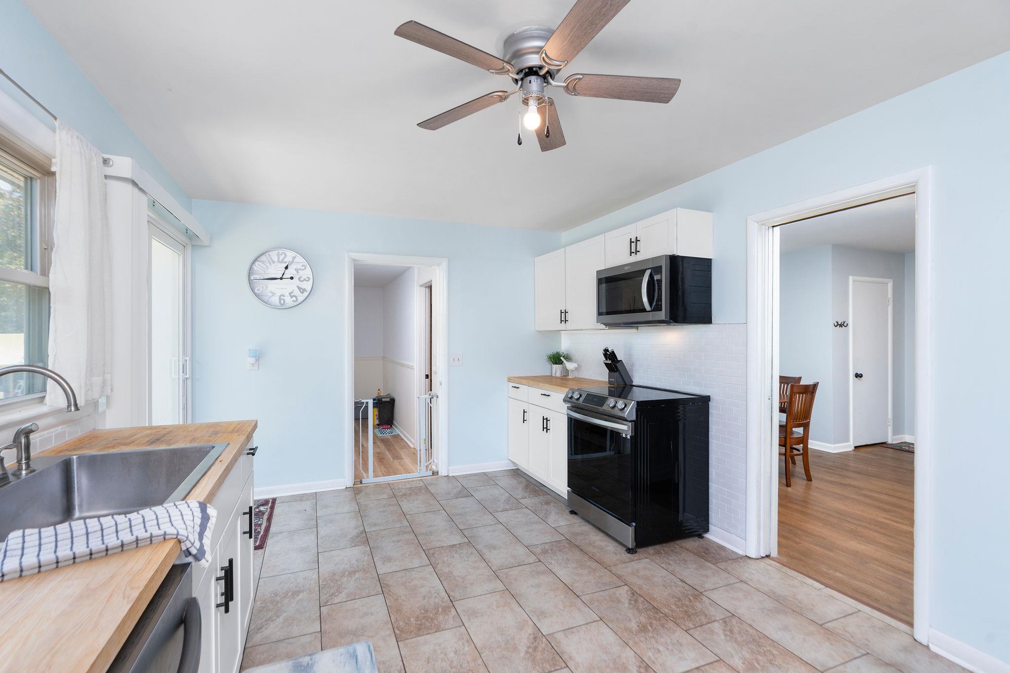 1064 Ladd Road Waynesboro, VA 22980 - Photo 10 of 51 a large kitchen with a stove a refrigerator and a microwave oven