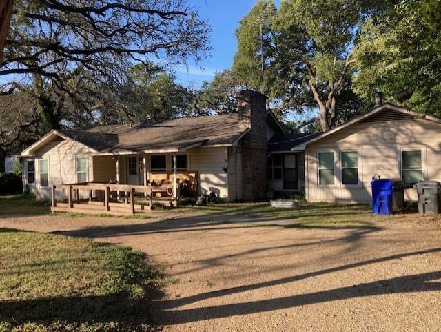 3900 North 27th Street Waco, TX 76708 - Photo 1 of 1 Ranch-style home with a chimney and a front yard