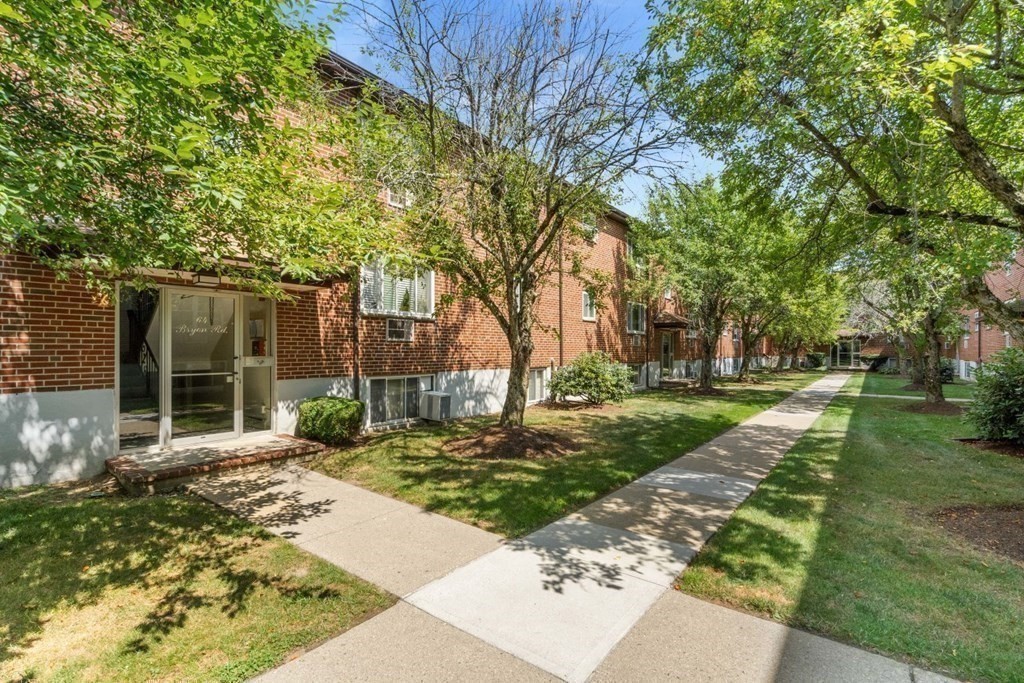 64 Bryon Road, Unit B641 Boston, MA 02467 - Photo 1 of 26 a front view of a house with a yard