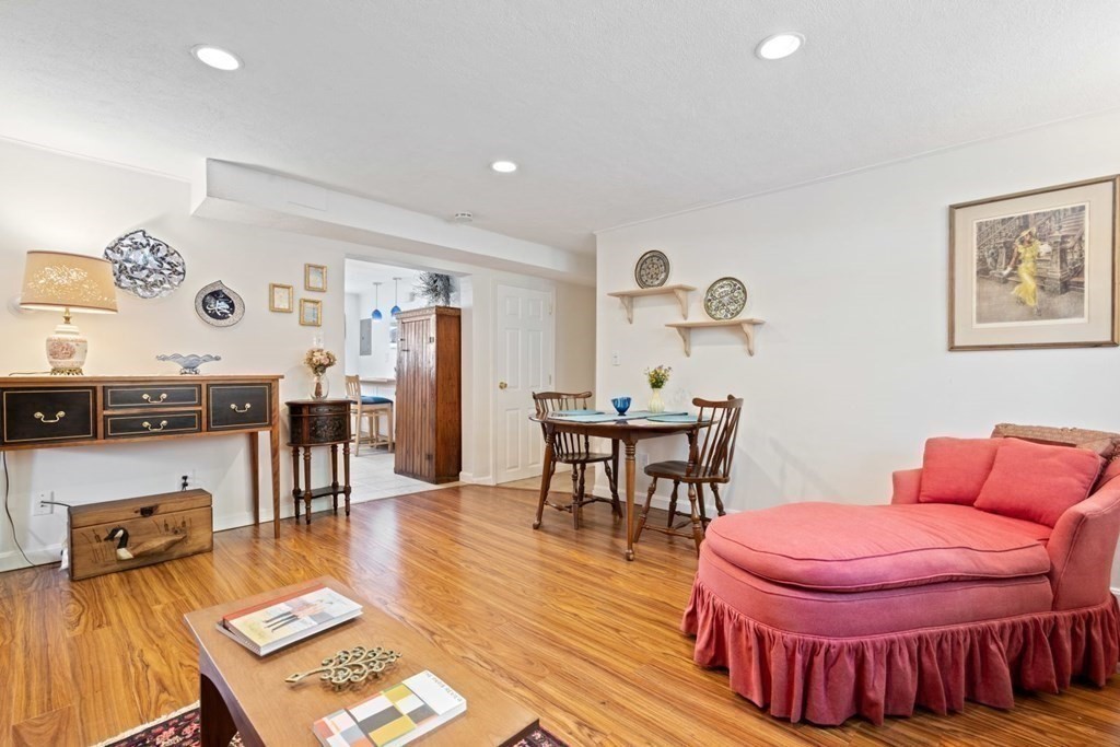 64 Bryon Road, Unit B641 Boston, MA 02467 - Photo 3 of 26 a living room with furniture and wooden floor