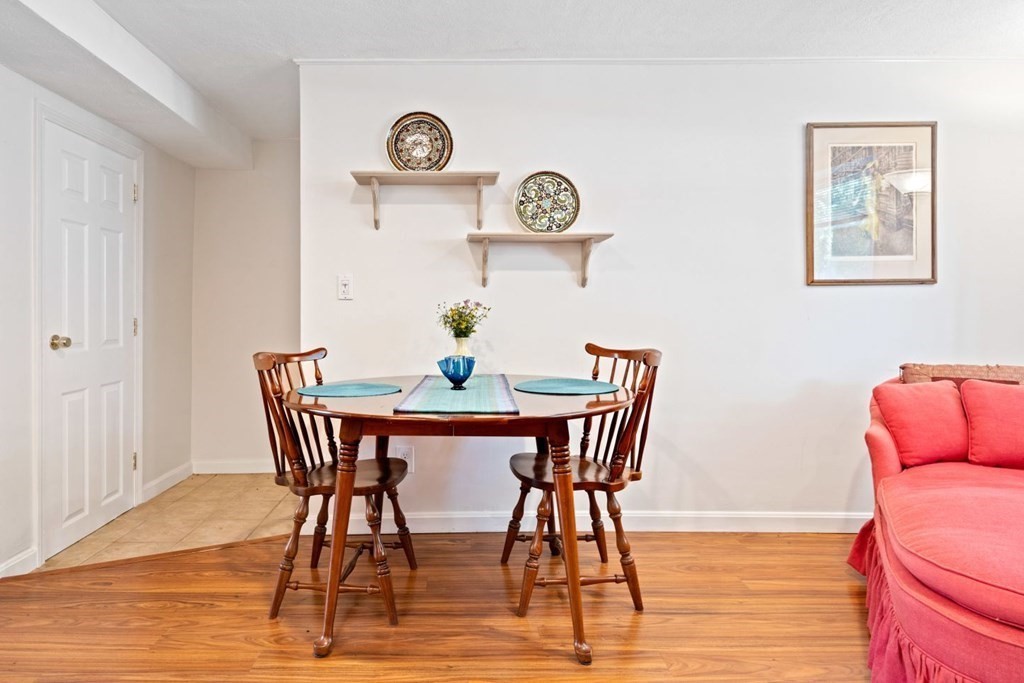 64 Bryon Road, Unit B641 Boston, MA 02467 - Photo 5 of 26 a dining room with furniture and wooden floor