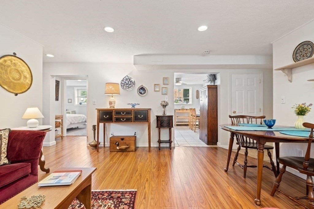 64 Bryon Road, Unit B641 Boston, MA 02467 - Photo 6 of 26 a living room with furniture and wooden floor