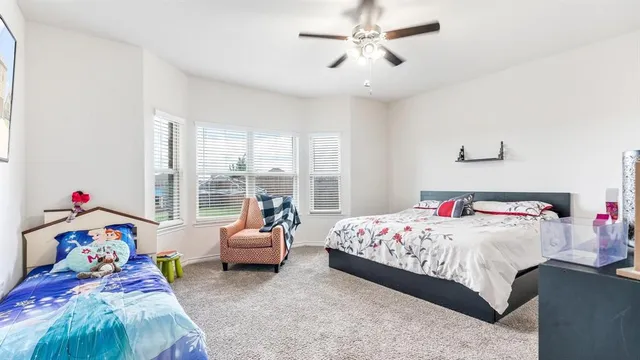 a bedroom with a bed and a couch