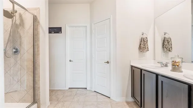 a bathroom with a sink and mirror