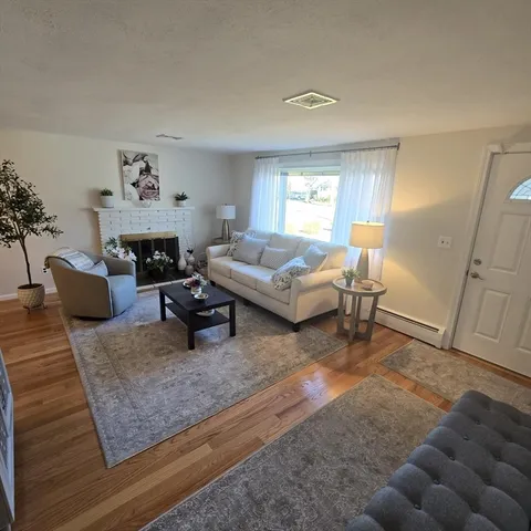 a living room with furniture and a rug