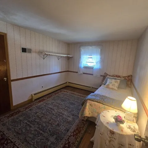 a room with bed and window