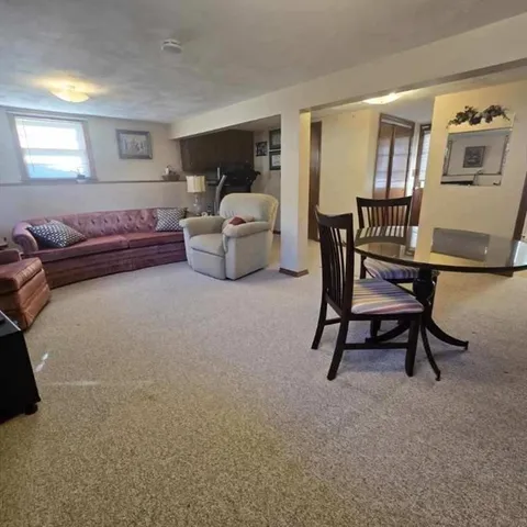 a bedroom with furniture and a lamp