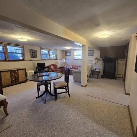 a living room with furniture and a rug