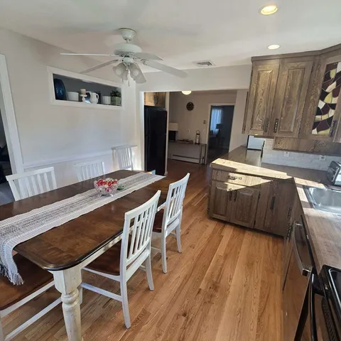 a dining room with furniture and window