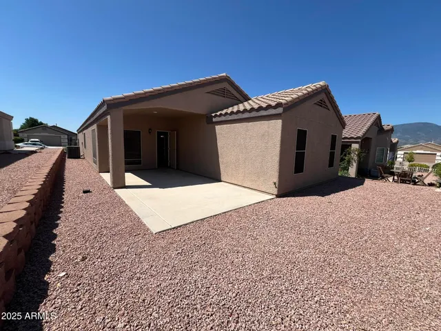 a view of a house with a snow in the yard