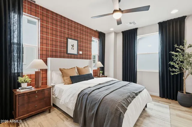 a bedroom with bed and a window