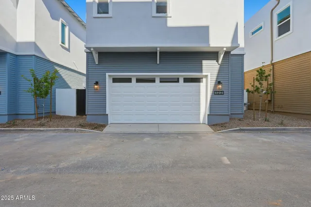 a front view of a house with a garage