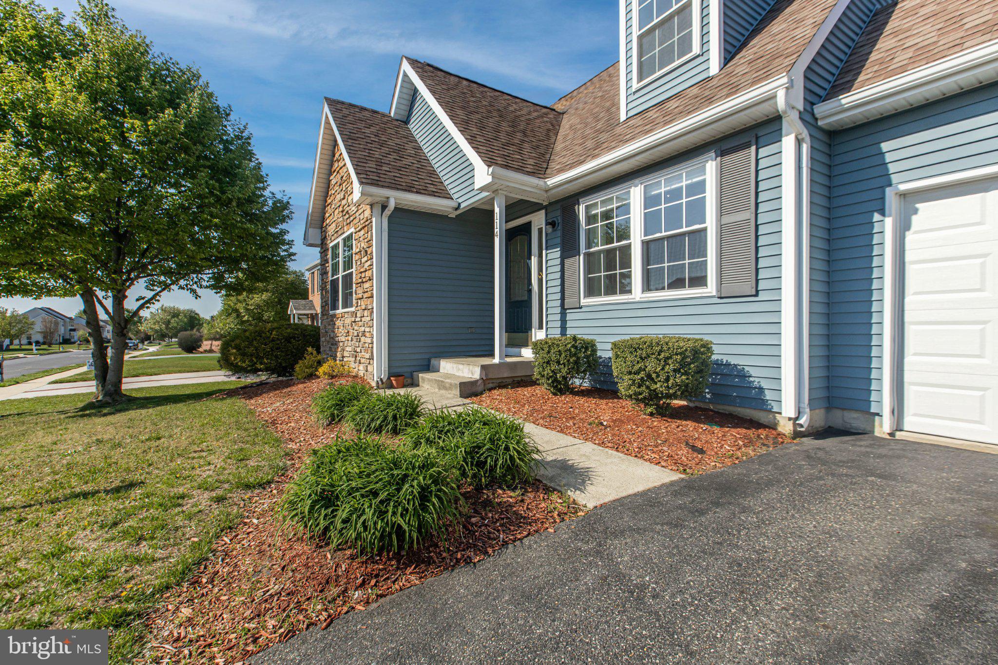 114 Sunset Drive Mount Royal, NJ 08061 - Photo 2 of 74 Charming blue home with lush landscaping.