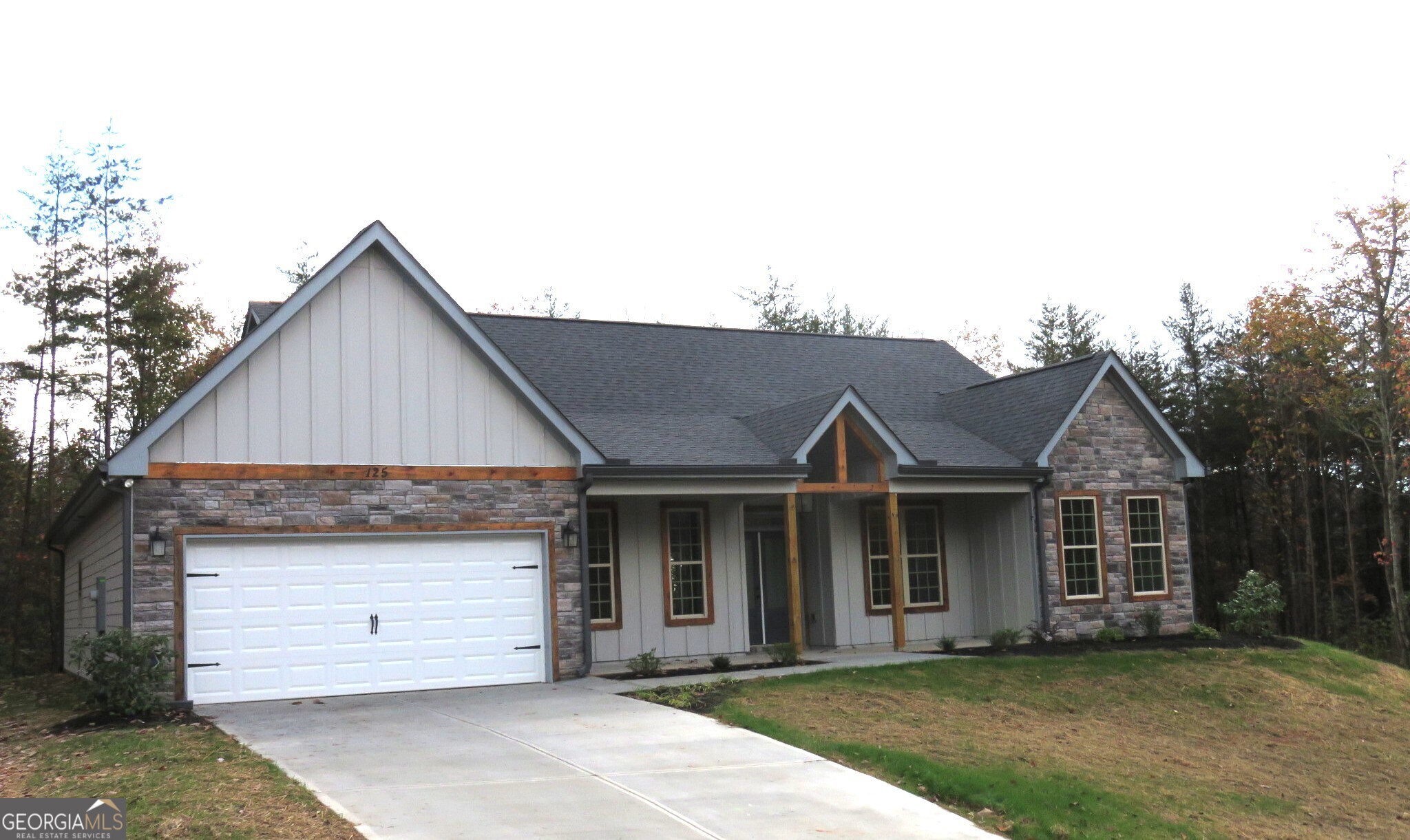 125 Chimney Ridge Cleveland, GA 30528 - Photo 1 of 1 a front view of a house with a garden