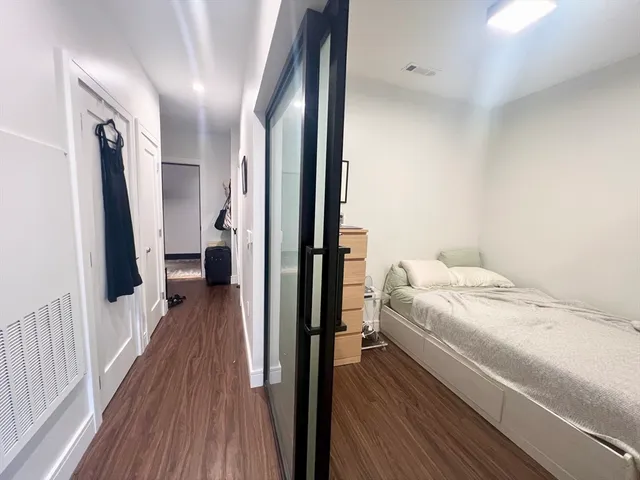 a bedroom with a bed and a desk