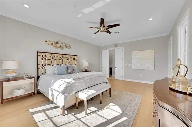 a spacious bathroom with a tub sink and mirror