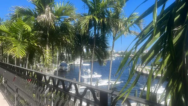 a view of a terrace with lawn chairs