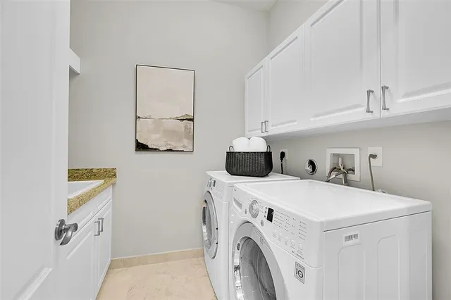 a view of a lake with a table and chairs